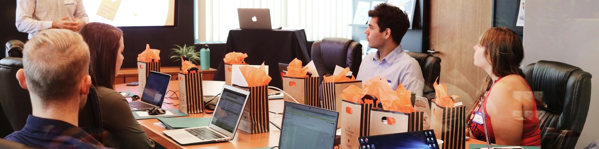 Editorial team planning content at a conference table
